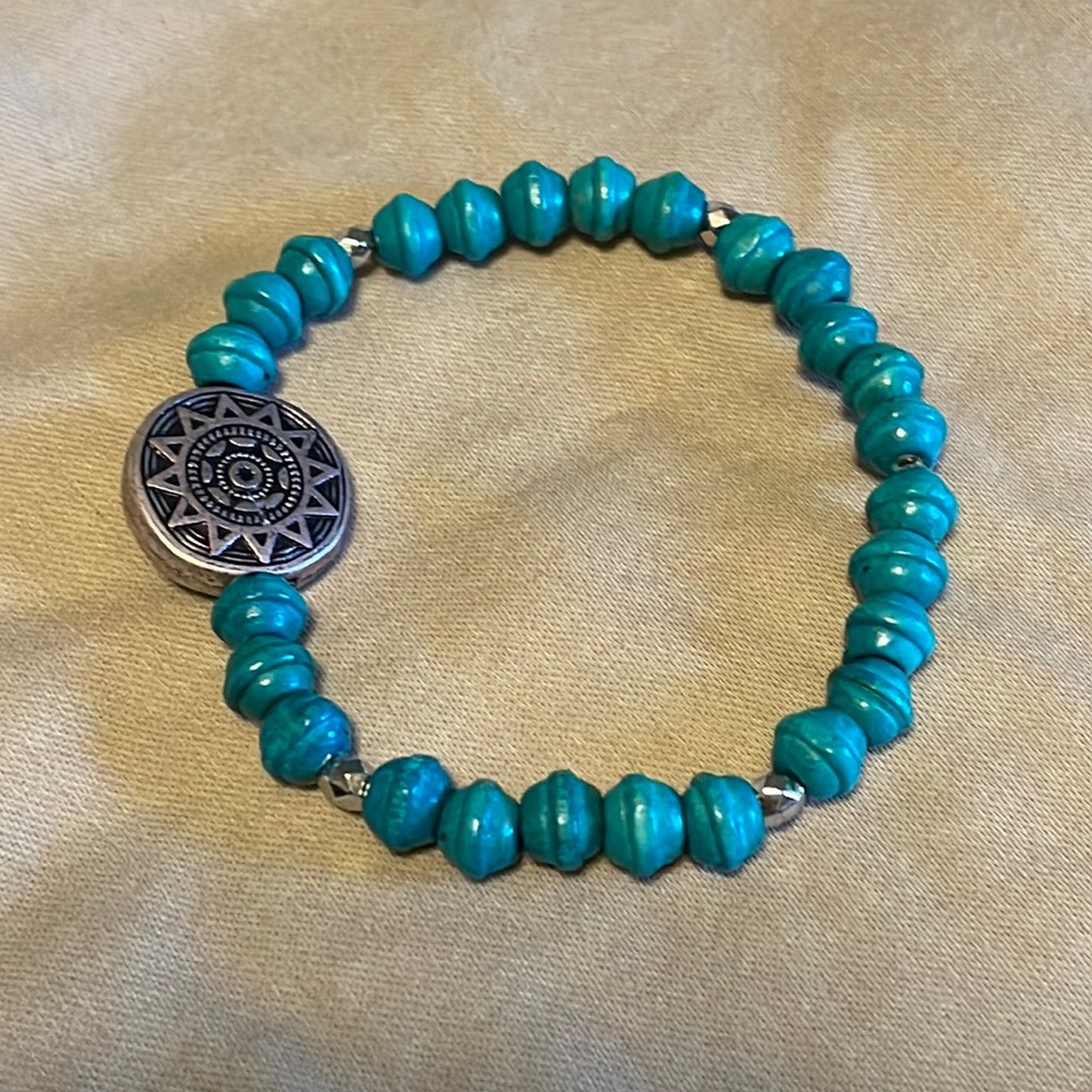 Wood bead bracelet with sun medallion